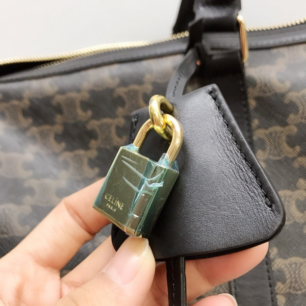 Ce**e large travel bag in triomphe canvas and calfskin