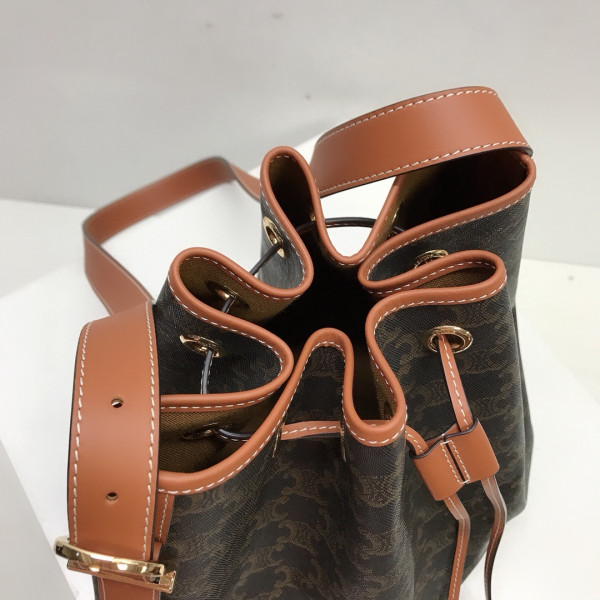 Ce**e medium drawstring bag in triomphe canvas